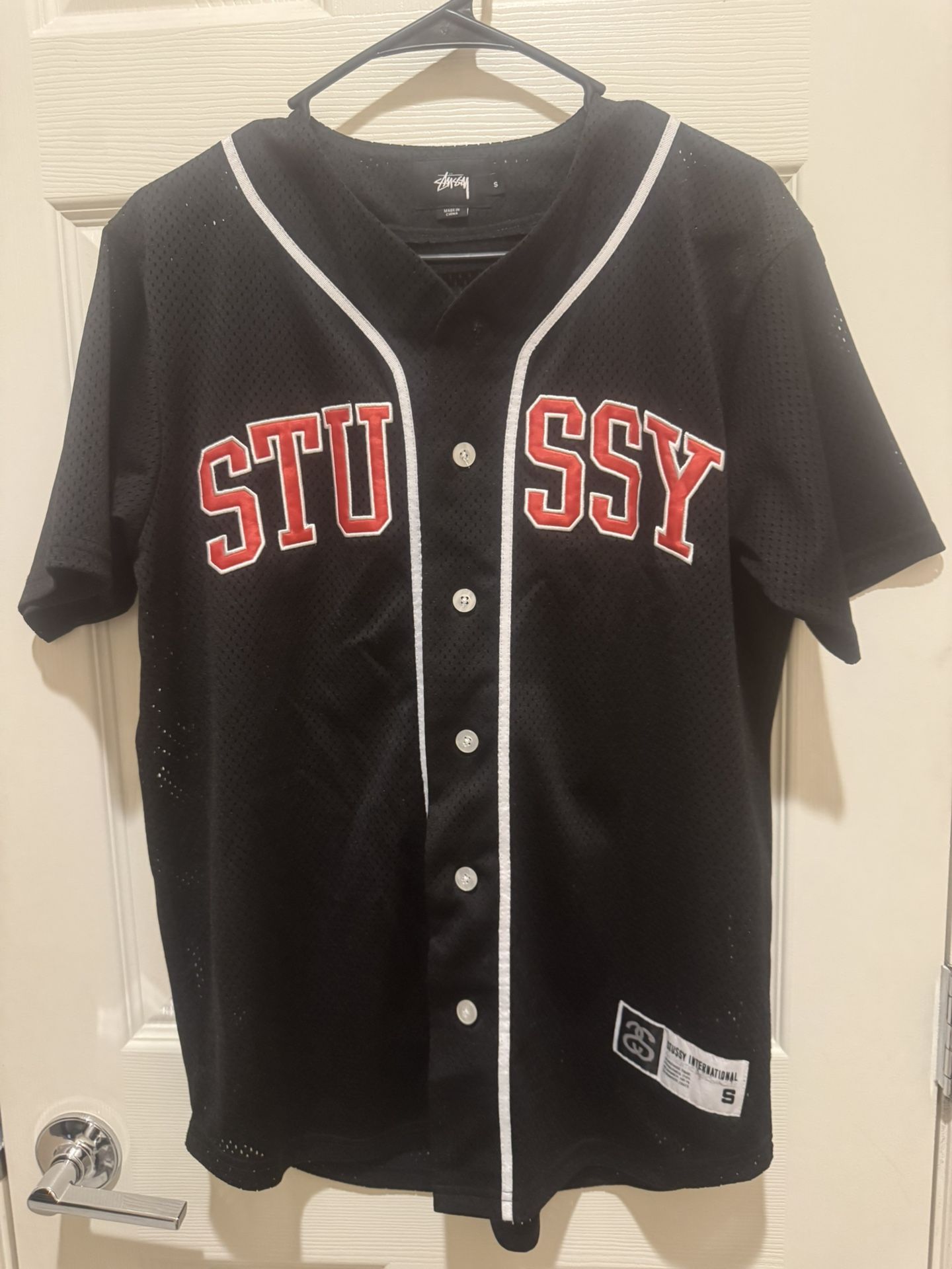 STUSSY Men’s Small Mesh Jersey Black With Red Letters And White Accents