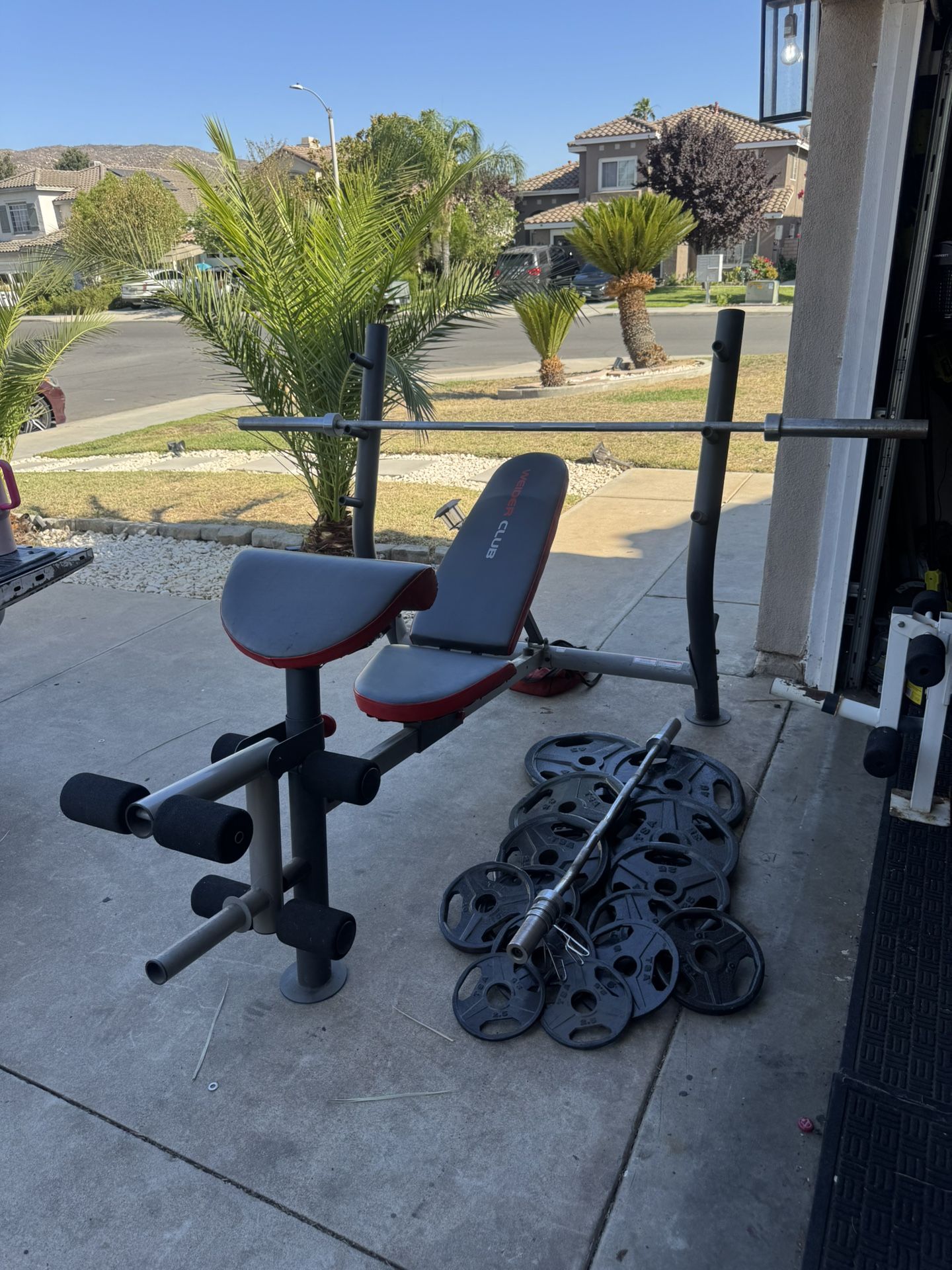 Bench press with 7ft bar plus 265lbs of Olympic weights and curl bar