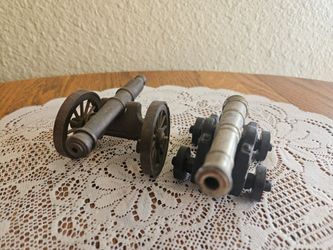 Pair of Cannons on Carriages. Brass and Bronze cannons on carraiges.