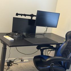 Office Desk- Electric Standing Desk,monitors ,dock , Mount , Sports Chair ,vedio Cam