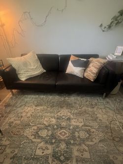 Brown faux leather sofa