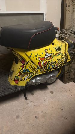 90s Honda moped with custom Beatles yellow submarine paint job