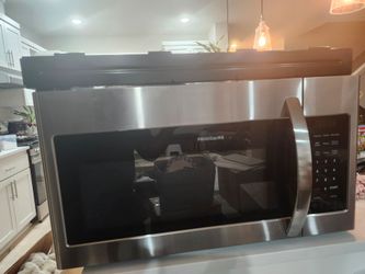 Frigidaire Over the range microwave brand new open box