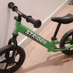 Green Strider balance bike