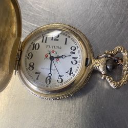 vintage Futura Mechanical pocket watch with fancy gold metal case chain train