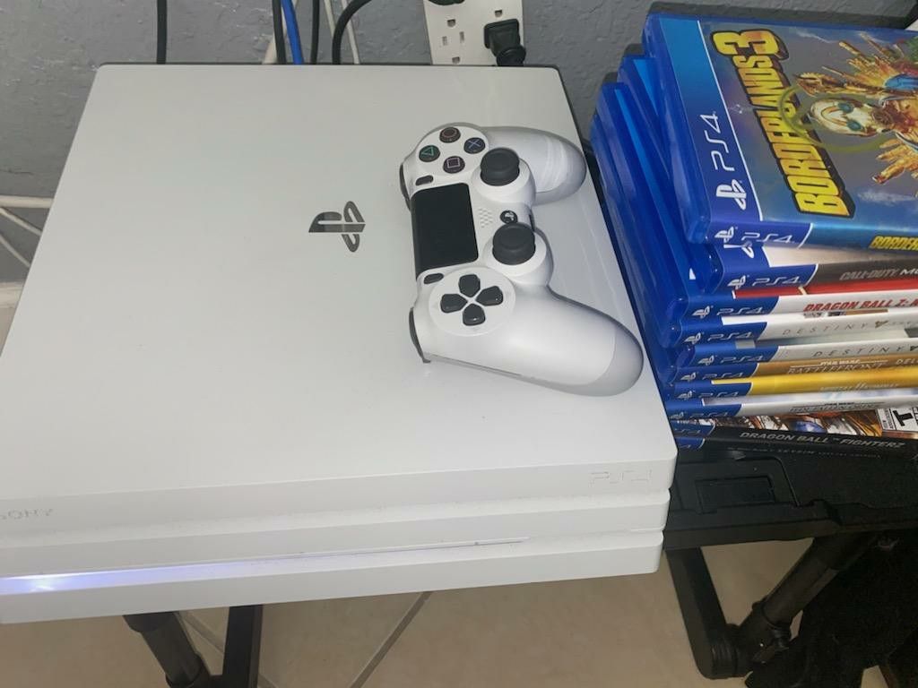 White PS4 PRO with 1TB of memory with 3 games