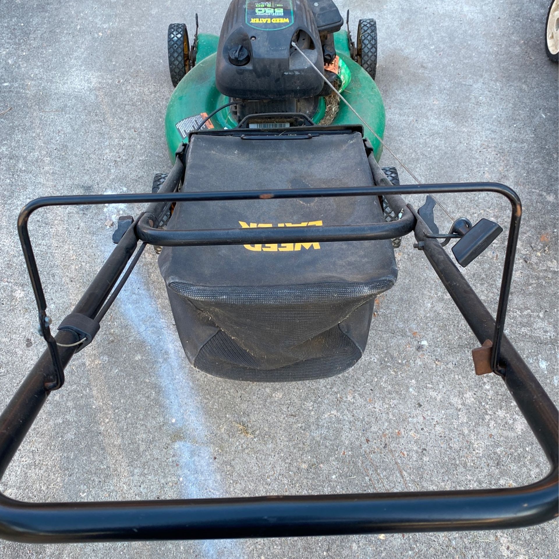 Two Running Lawn Mowers