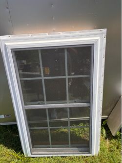 Used  vinyl window with screen