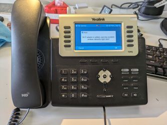 Yealink SIP-T29G Gigabit VoIP Business Phone with AC Adapter and Wifi Dongle.
