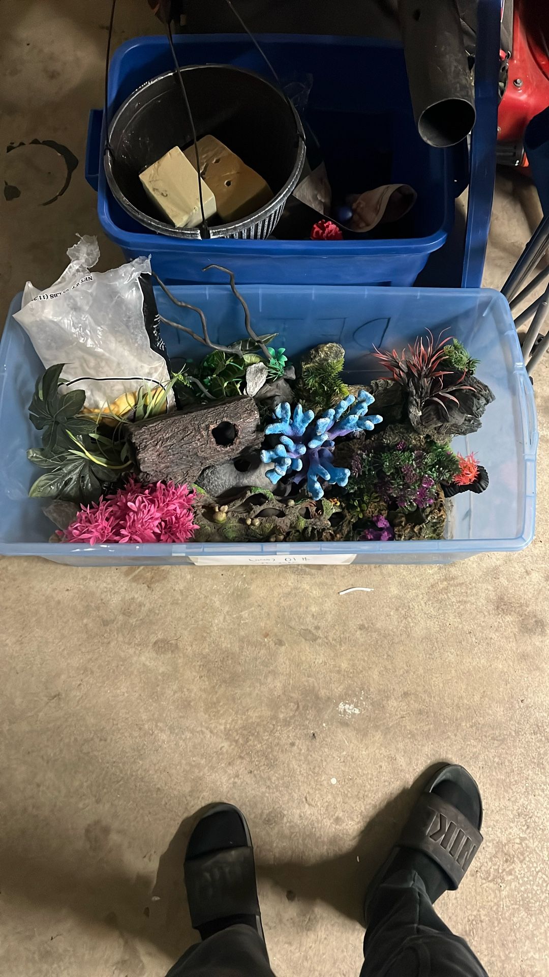Tub Full Of Fish Tank Decor And Pebbles