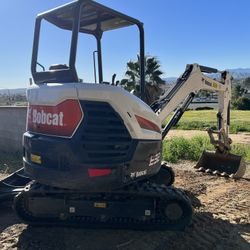 Bobcat E32, 4 Buckets & Compaction Wheel