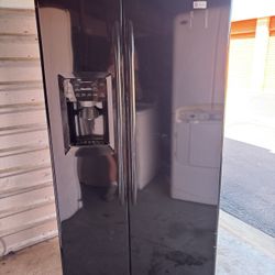Black GE Refrigerator And Freezer
