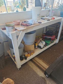 Utility table 72 in. long 25 in. wide 49 in height with rollers
