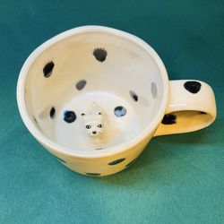 Adorable Anthropology peaking puppy mug