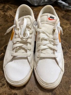 Nike Low-Top White Sneakers with Orange Swoosh