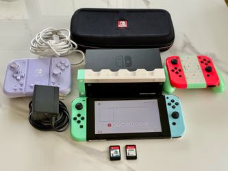 Nintendo Switch + 2 Games + HORI Split Pad + Extra Joy-Cons + Travel Case