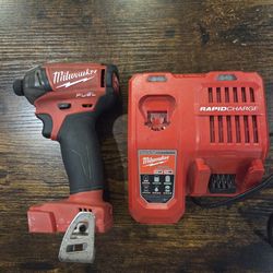Milwaukee Fuel Surge m18 Impact Driver and Milwaukee Rapid Charger