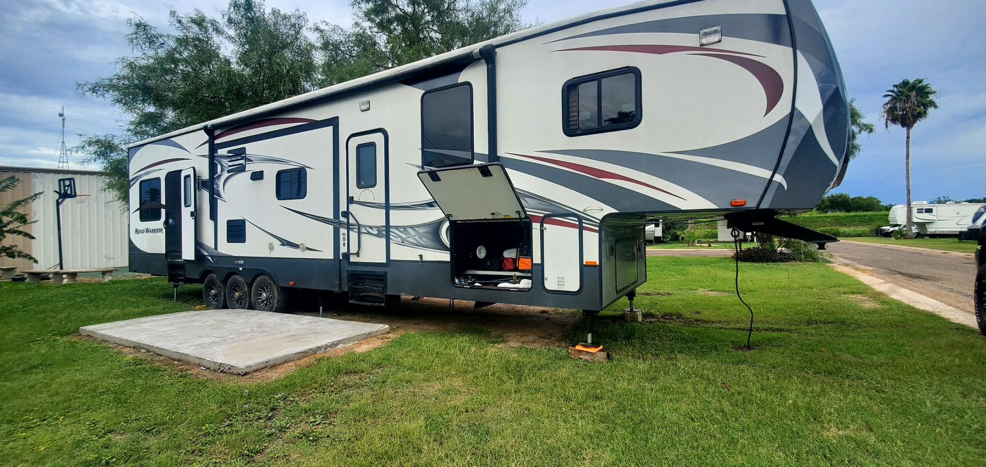 Selling a 2012 Heartland Road Warrior 415 Toy Hauler, 45 ft long and 16500 lbs weight, dry.
