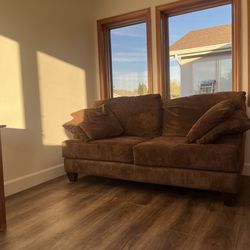 Brown sofa and pillows