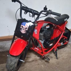 I'm selling my mini bike. It has headlights and turn signals, handles very well, and has a clutch. It reaches a speed of 50 mph.