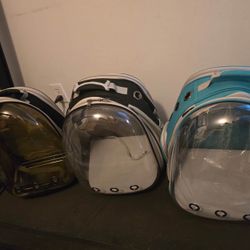 Pet carrier backpack with back extension   Uv with plate  Black  Green new with dent in middle as pic shows 