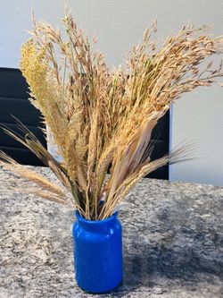 Artificial flower with blue vase