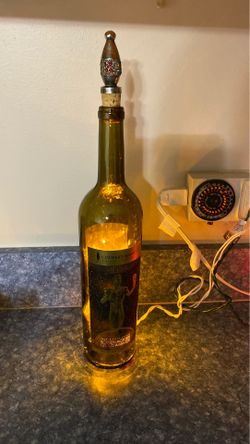 Bottle with lights and topper