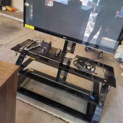 Tv With Black Glass Stand