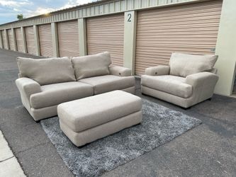 Light gray sofa couch with ottoman and chair