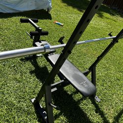 Workout Bench With A 7 Ft Olympic Bar 