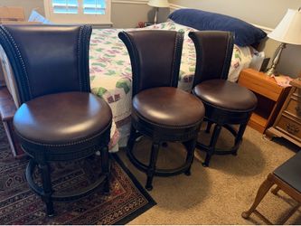 3 Swivel counter height barstools with leather seats and backs