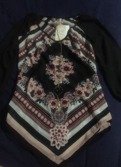 Long sleeve floral blouse.