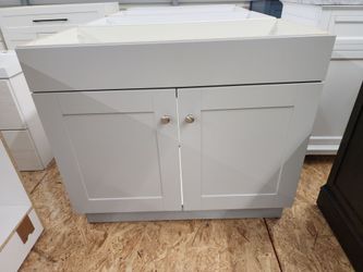 Brand New 36-in Vanity Cabinet in Light Gray. Sink not included.