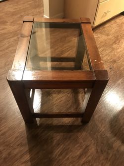 Brown wooden framed glass top End table