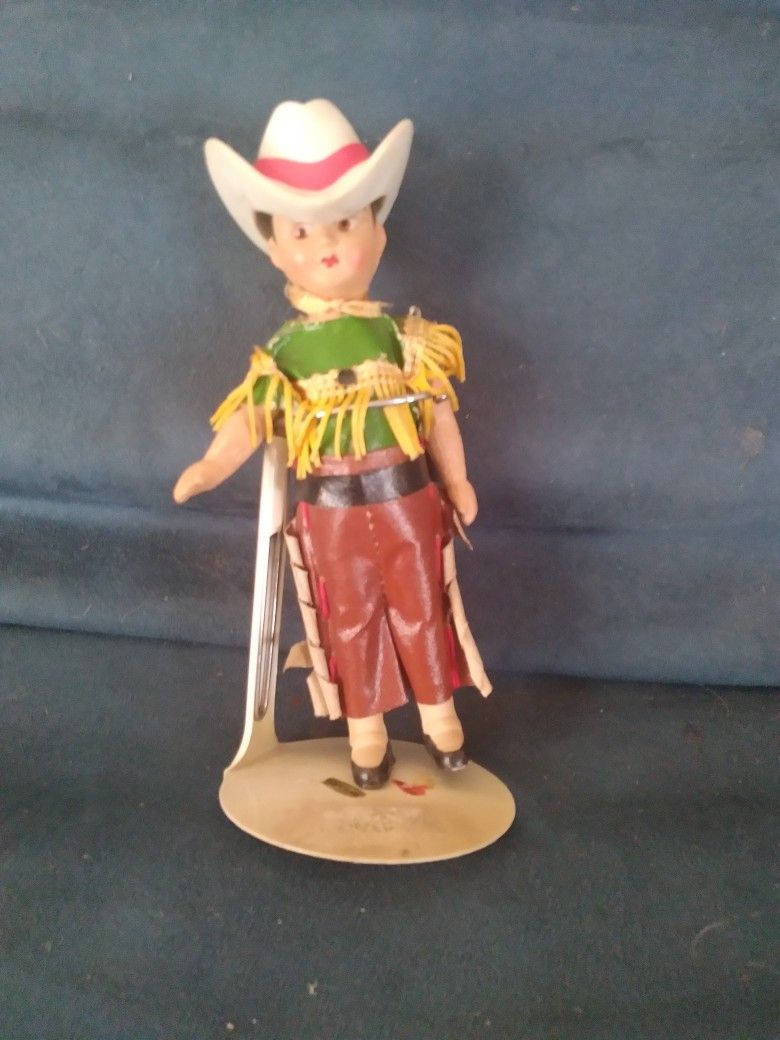 7-inches tall vintage cowgirl doll with a removable hat