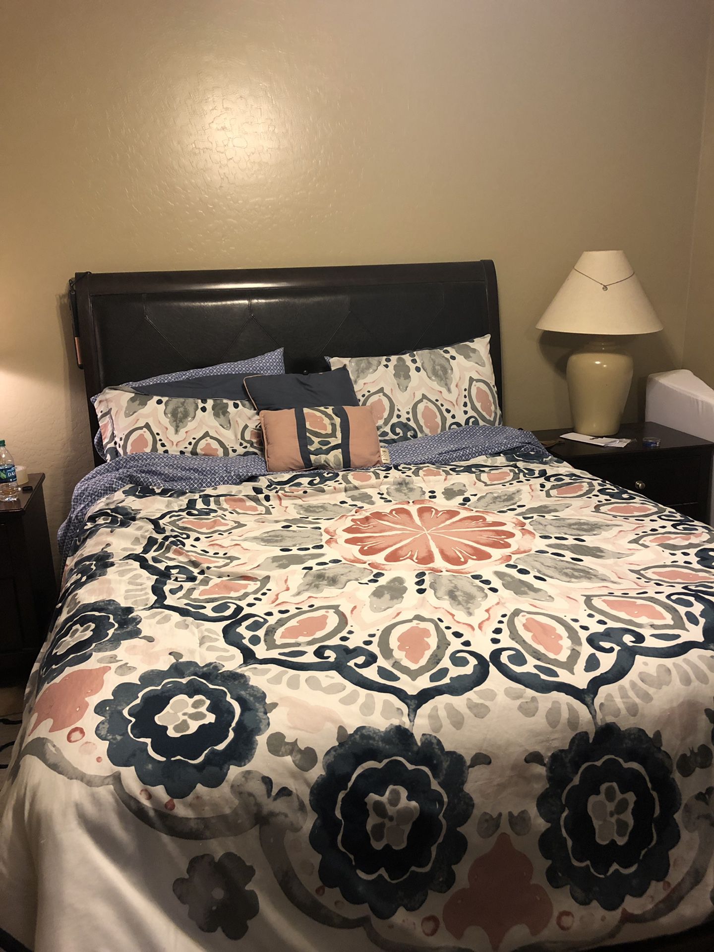 Queen size bed. Mattress and box spring included. Included lamps and night stand plus big dresser with mirror. Well taken care of. Color is dark wood