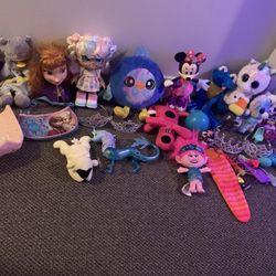 Girls fun toy lot.  Includes Elsa Anna frozen toys, stuffy’s, unicorns, dolls, trolls, purses, Minnie Mouse dancing and light up sing along toy., prin