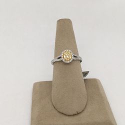 18 karat white gold oval cut, Fancy yellow diamond halo ring with split shank