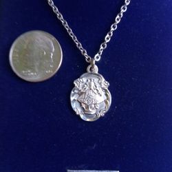 Sterling Silver Virgin of San Juan Medal on an 18 inch stainless steel chain. Religious jewelry.