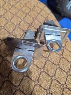 chrome stake pocket anchor points for pickup truck beds.