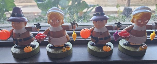 Set of 4 Thanksgiving-themed pilgrim figurines with pumpkins, corn and other fruits &amp; vegetables.

Solar-Powered Fall Thanksgiving Pilgrims

Just 