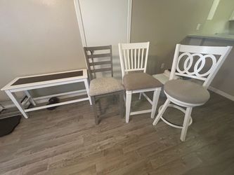 3 chairs and a bench