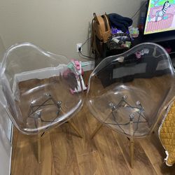 2 clear acrylic chairs
