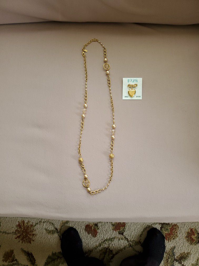 35" Goldtone Beaded Necklace & 1 Goldtone Locket Decorative Pin. Both pieces are 1928 Jewelry Brand.