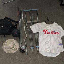 XL Phillies Baseball Jersey | Camo Bucket Hat | Crutches | 3 Golf Clubs | 10lbs Medicine Ball | Black Bag (BUNDLE)
