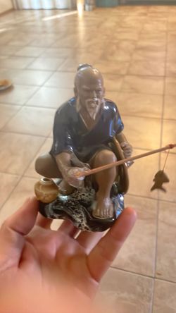 Mudman fisherman figurine