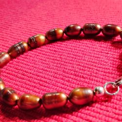 TIME FOR YOU TO SHINE! THIS IS A FIERY 7.5 INCH LONG / 925 SOLID. GOLDEN BROWN, OVAL 7X9 MM LARGE SALTWATER PEARL BRACELET.
