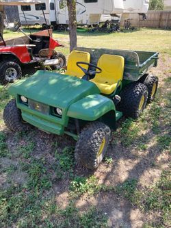 Six wheel John Deere gator