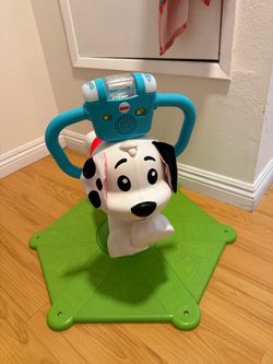 Fisher-Price Toddler Learning Toy, Bounce and Spin Puppy Stationary Ride-On Bouncer