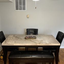Marble table with 3 chairs, bench and storage